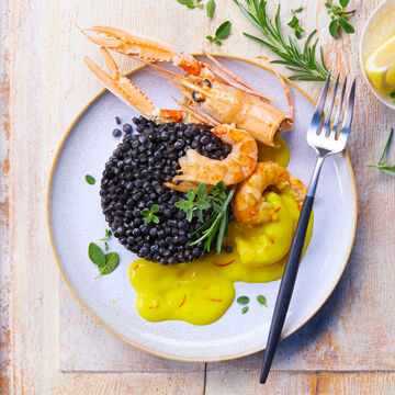 Image du produit pour 'Fregula sarda nero con scampi e salsa allo zafferano '